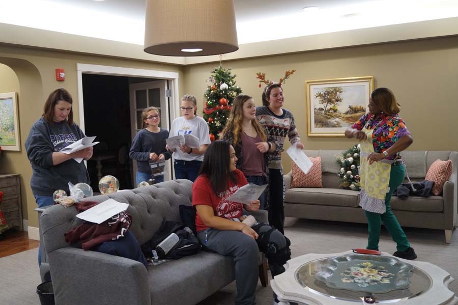 After being done with singing. The members decided to jam out on Jingle Bell Rock with the staff at Piper Assisted Living Facility. 