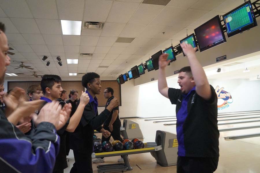 After a good round in Baker, junior Cody Davis rallies up his team along with the crowd with his return from the lanes.