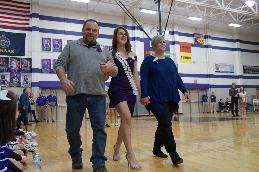 William and Mavis Hutching accompany their daughter onto the court for her nomination as courtwarming queen.