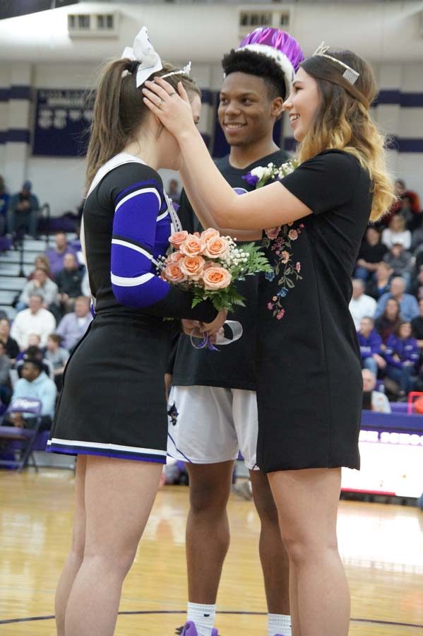 Sophia Frick accepts her tiara from former queen Bel Wilcoxen at the courtwarming crowning Feb 9.