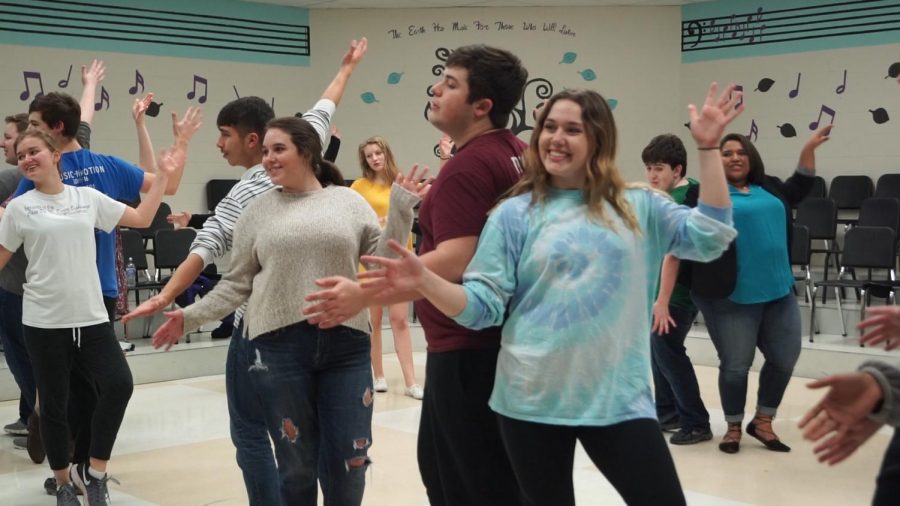 Senior Grace Vogel and junior Drew Novak dance to  "Footloose" while rehearsing for Stage Live.