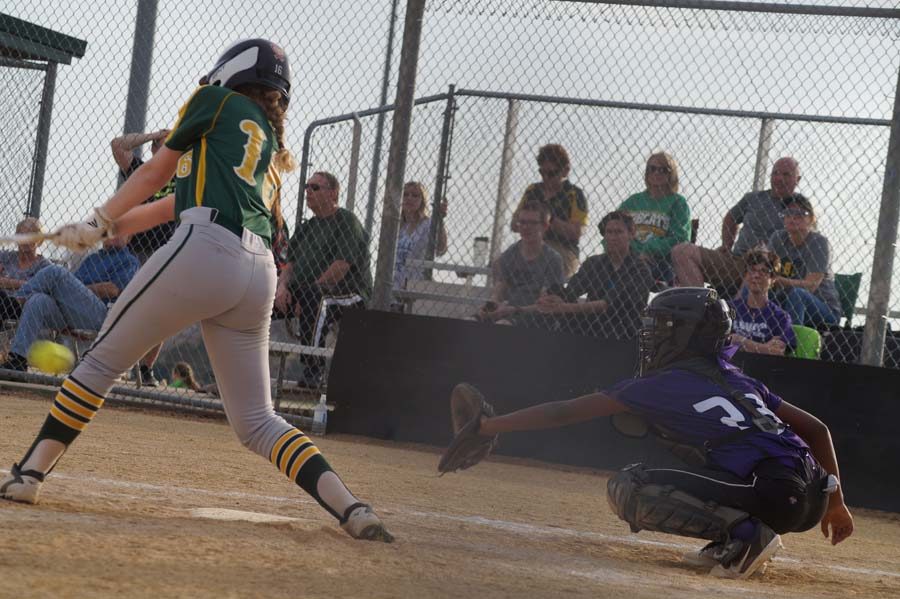 Freshman Taylor Sims is behind the plate at the game on April 12. She catches the ball as Basehor has a swing and a miss.