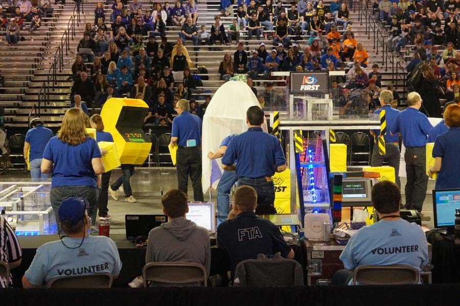 As the teams get ready during the opening ceremonies on the last day of competition the volunteers put on a show with Pac-Man.