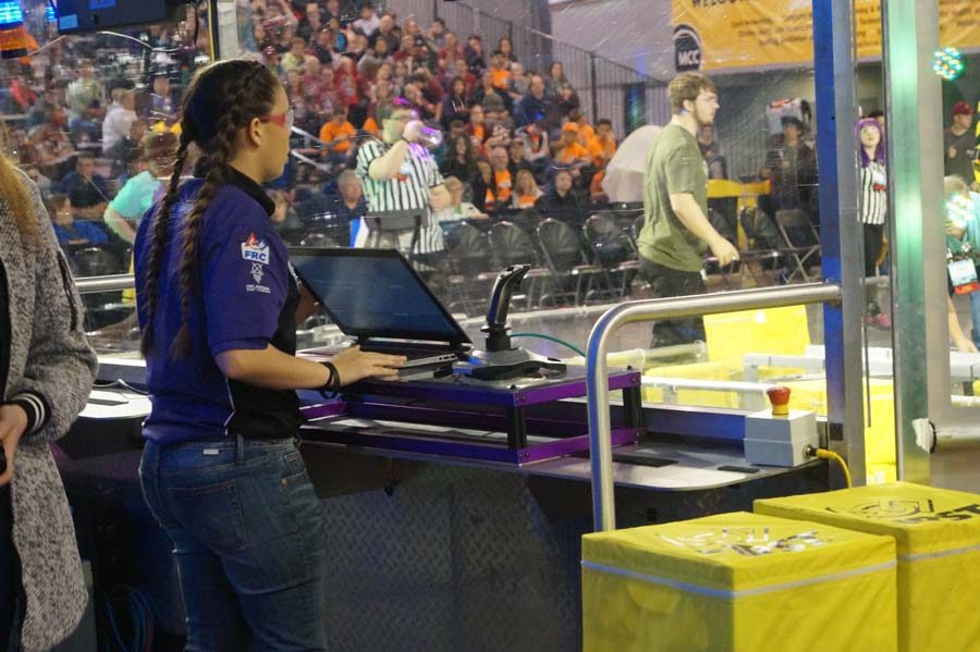 Senior Emma Morgan is the driver for the first round of the day. Their team won the round with collaboration from the other robotics team.