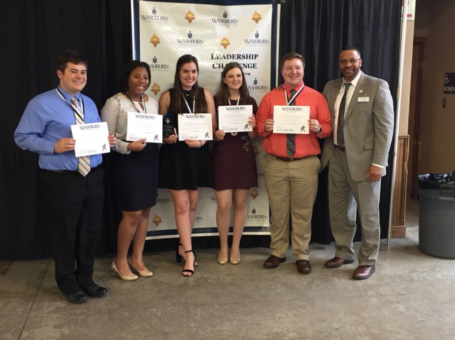 Student council representatives pose with their winning certificates. 