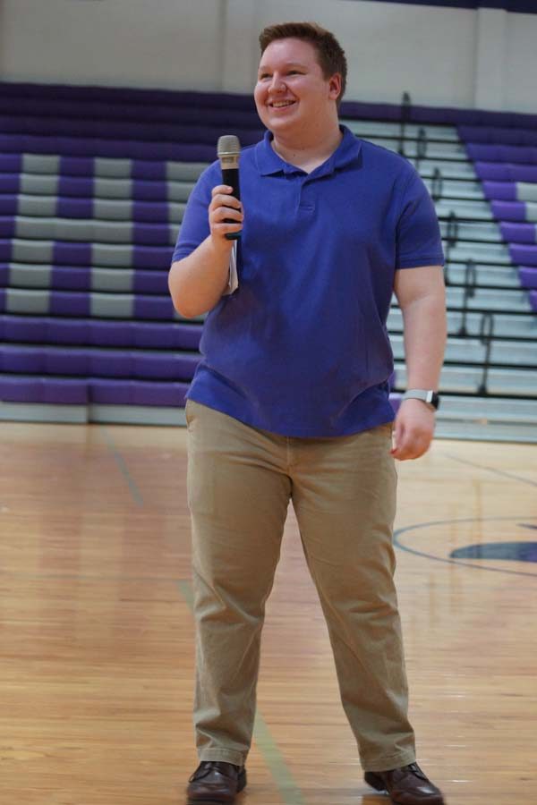 Senior Scott Ladish keeps the crowd engaged as an audience member tells him their favorite joke while they wait for the dancers to change outfits. 