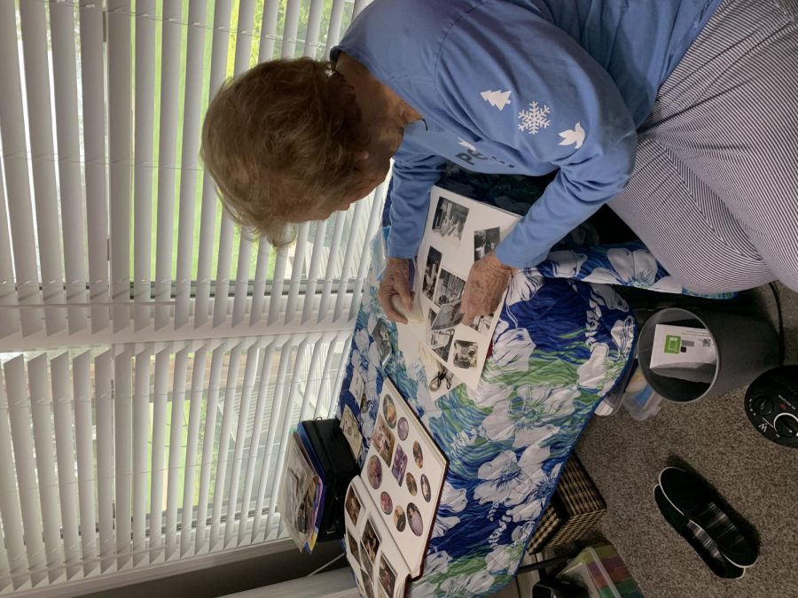 Evelyn Eisman is putting pictures together to form a scrapbook on the afternoon of April 16 in her bedroom. Evelyn decided to spend her time in quarantine by putting all of her pictures of her kids and grandkids into a book to form a scrapbook. 
Photographed by Alex Ivanuska
