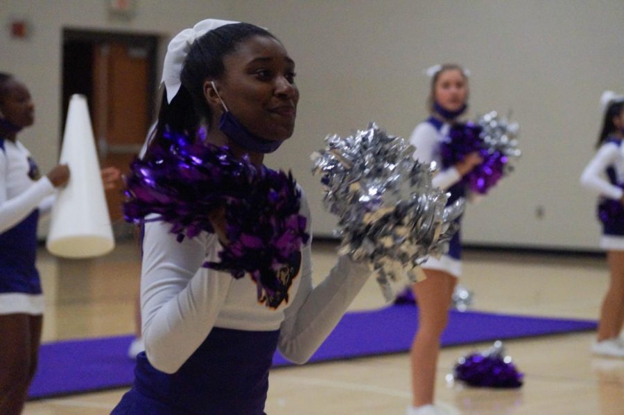 Sophomore Jillian Collier performs the Cheer during practice November 5.