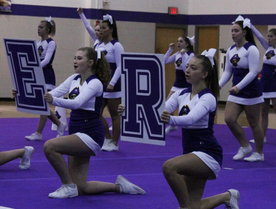 Sophomore Alana Crone (left) and Junior Kaycee Scott (right) perform the Band Chant during the state performance November 15.