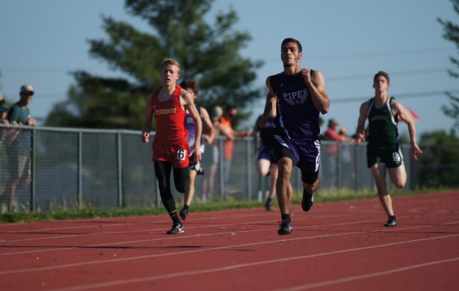 Senior Divante Herrig-Brittian runs the 200 meter sprint Friday, April 30 at the Basehor-Linwood track meet hosted by DeSoto High School. Herrig-Brittian placed 1st and broke his previous record.