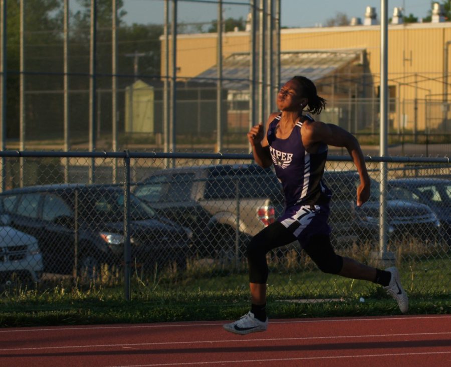 Sophomore Tiwjuan Griffin runs the 400 meter sprint Friday, April 30 at the Basehor-Linwood track meet hosted by DeSoto High School. Griffin ran the 400 meter sprint right after running the 4x1 relay and placed 7th overall.