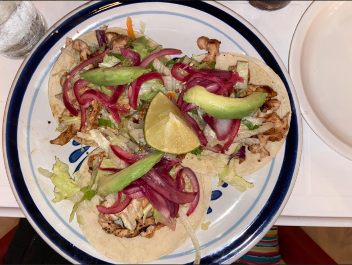 Chicken street tacos topped with avocado, pickled onions and lettuce from picus in Isla Mujeres.